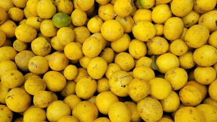 Lemons in the market. Fresh lemon background texure or wallpaper