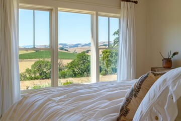 farmhouse bedroom with a view of hills