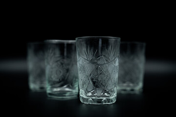 pile of glasses with water on black 