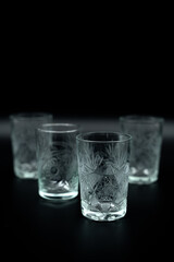 glasses with water on black close up