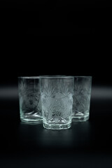 glasses of water on black background