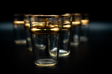 glass of water with gold rings