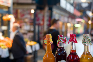 Bottled homemade syrup in the market hall