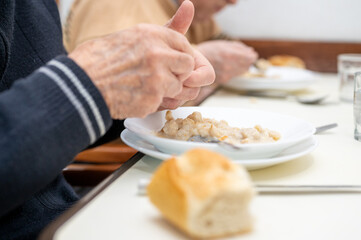 Close up of an elderly man having lunch at nursing home. High quality photo
