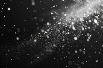 Snowflakes falling in spacelike black and white photo
