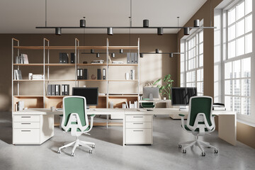 Stylish office coworking interior with pc computers and armchairs in row, window