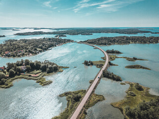 Areal view of a narrow road in the middle of the sea. Åland island, Finnish archipelago