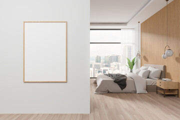 White and wooden master bedroom interior with vertical poster