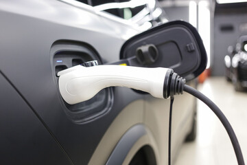 Close-up of electric car charging, ecology transportation concept. EV Car or Electric car at...