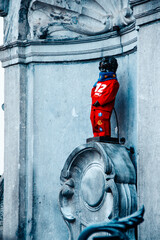 Manneken Pis statue dressed for emergency day, Bryssels, Belgium