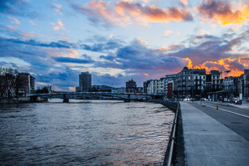 Sunset over the river, riverwalk and the city of Liège, Belgium.