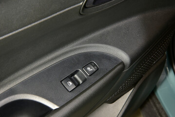The button for raising the windows and the button for heating the seats in the car - 798754184