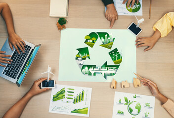 Eco city and recycle illustration placed on a meeting table during a green business meeting...