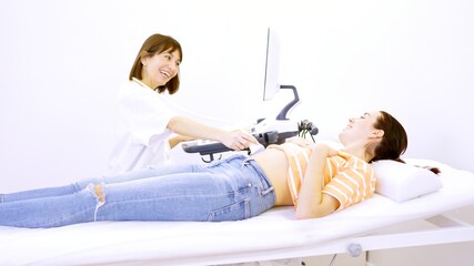 Doctor informs a patient that she is pregnant during ultrasound