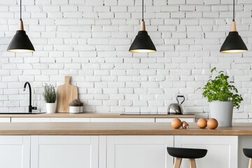 Kitchen with white brick wall, wooden countertops, and black pendant lights