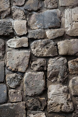 Textured surface of cobbled stones, showcasing their irregular shapes and worn surfaces. Cobbled stone textures offer a classic and timeless backdrop