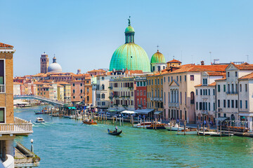 View of the gondolas of the Grand Canal on a sunny day in Venice, Italy
