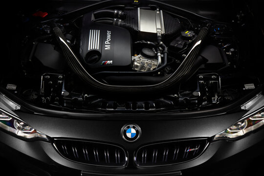 Engine of black BMW M3. Engine R6, 450hp. Open bonet. Katowice, Poland, 12.03.2016