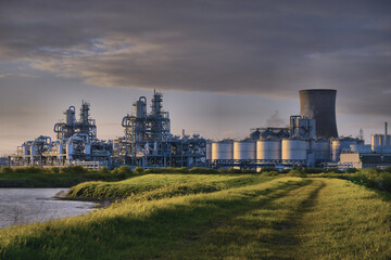 HDR Oil refinery, cooling towers, with smoke.