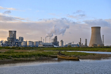 HDR Oil refinery, cooling towers, with smoke.