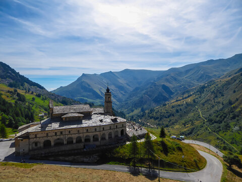 Scenic view of mountain sanctuary known as Santuario di San Magno in Castelmagno, Valle Grana, province of Cuneo, Piedmont, Italy. Saint Magnus stronghold. High alpine mountain road