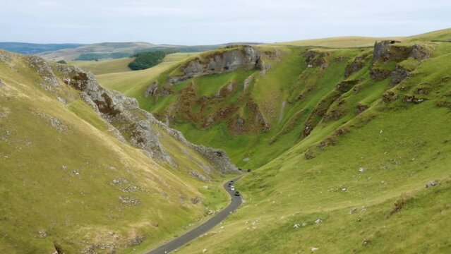 Winnats Pass carboniferous limestone gorge in Peak District National Park near Castleton, Derbyshire, England. Video fly down from west