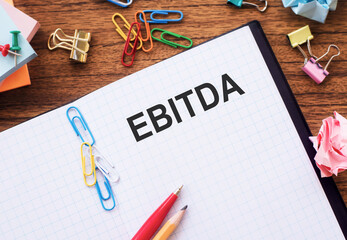A binder with the word EBITDA written on it, representing a financial concept.