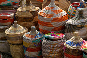 collection of colorful baskets made of woven materials