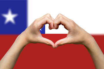 Fototapeta premium Chile flag with two hands heart shape, vector design, patriotism and nationalism idea, support 