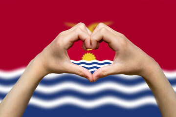 Kiribati flag with two hands heart shape, patriotism and nationalism idea, support or donate to 