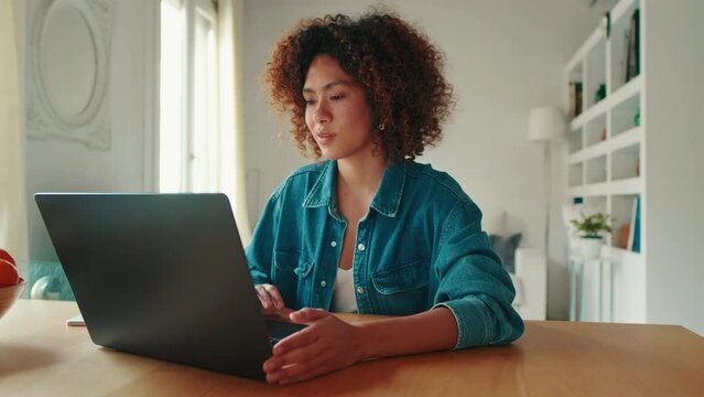 Young woman student using laptop computer