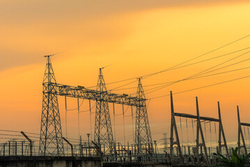 High voltage pole electric wiring distribution landscape energy engineering. Electricity energetic background with blue sky green mountain in countryside. Electric power energy engineering industrial