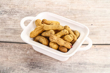 Raw ripe unpeeled peanut heap