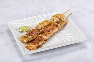 Grilled salmon skewer with sauce