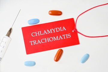 Chlamydia trachomatis on a red card with a rope on a white background