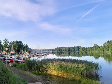 View of Lake Wdzydze and the marina in the distance. Sailing on Lake Wdzydze, one of the largest lakes in Poland.