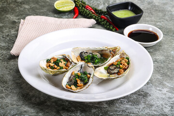 Open half oysters with green onion
