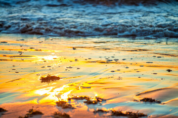 Sunset beach and water reflections