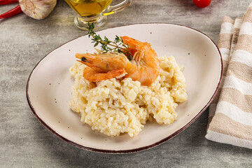 Italian risotto with prawn served thyme