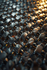 Obraz premium Texture resembling metallic chainmail, featuring interlocking rings and metallic shine. Metallic chainmail textures offer a medieval and armor-inspired backdrop