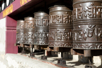 Rolling the Manicha (prayer wheel) has many meanings for Buddhists.
