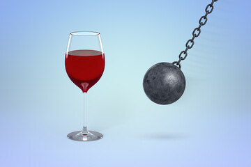 Wine glass threatened by swinging wrecking ball