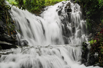 Fototapeta premium waterfall in the mountains, long exposure, curug madu