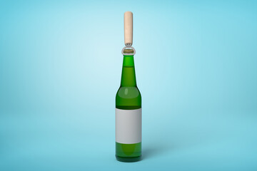 Green bottle with label and popsicle stick top