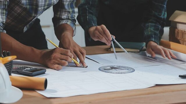 Business Meeting Time with Architecture Interior Designer and Engineering. Meeting and Discussion about Construction Progress in work and Figures denoting of Accounting and Financial