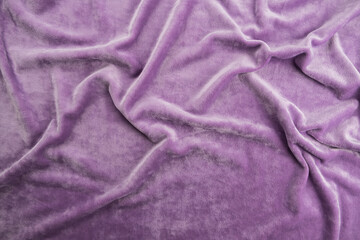 Texture of light purple velour fabric, top view. A noble purple shade with rich drape and a smooth...