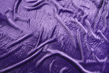 Texture of purple velour fabric, top view. A noble purple shade with rich drape and a smooth...