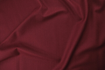 Texture of burgundy colored suit fabric texture, top view, abstract background.