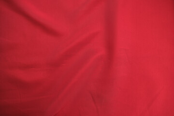 Texture of red colored suit fabric texture, top view, abstract background.