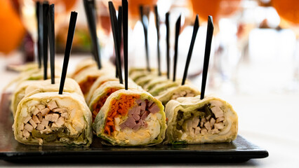 Appetising sushi rolls are filled with various ingredients: fish, vegetables, rice. Sushi rolls are...